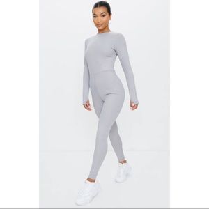 Grey long sleeve thumb hole jumpsuit.